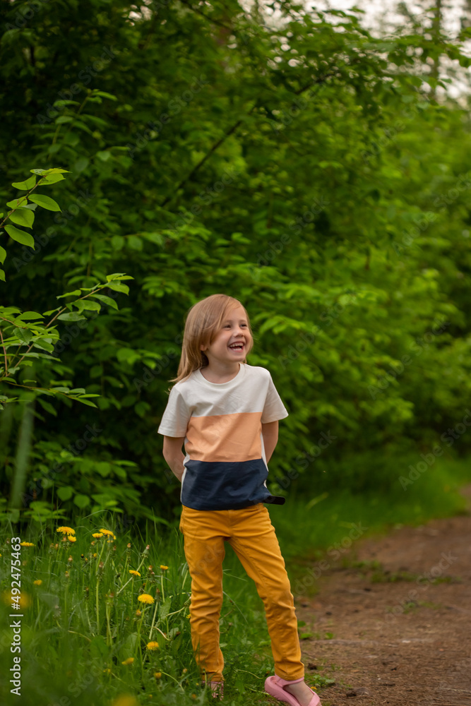 Portrait of cute little caucasian girl in casual closing in the forest Portrait of cute little caucasian girl in casual closing in the forest