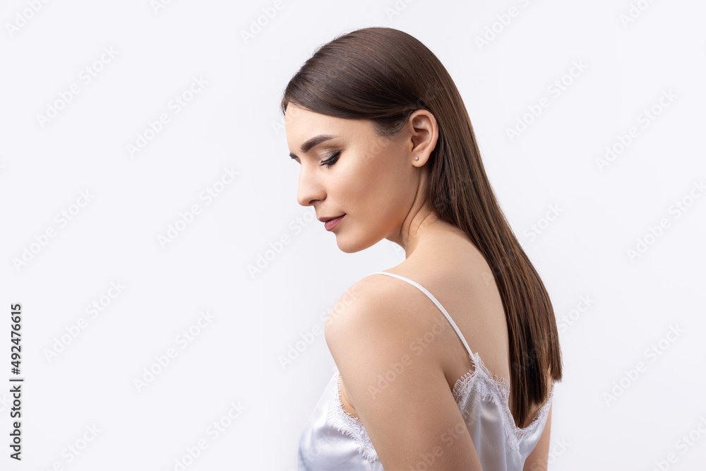 Beautiful smiling woman with clean skin, natural make-up and white teeth on a gray background Beautiful smiling woman with clean skin, natural make-up and white teeth on a gray background