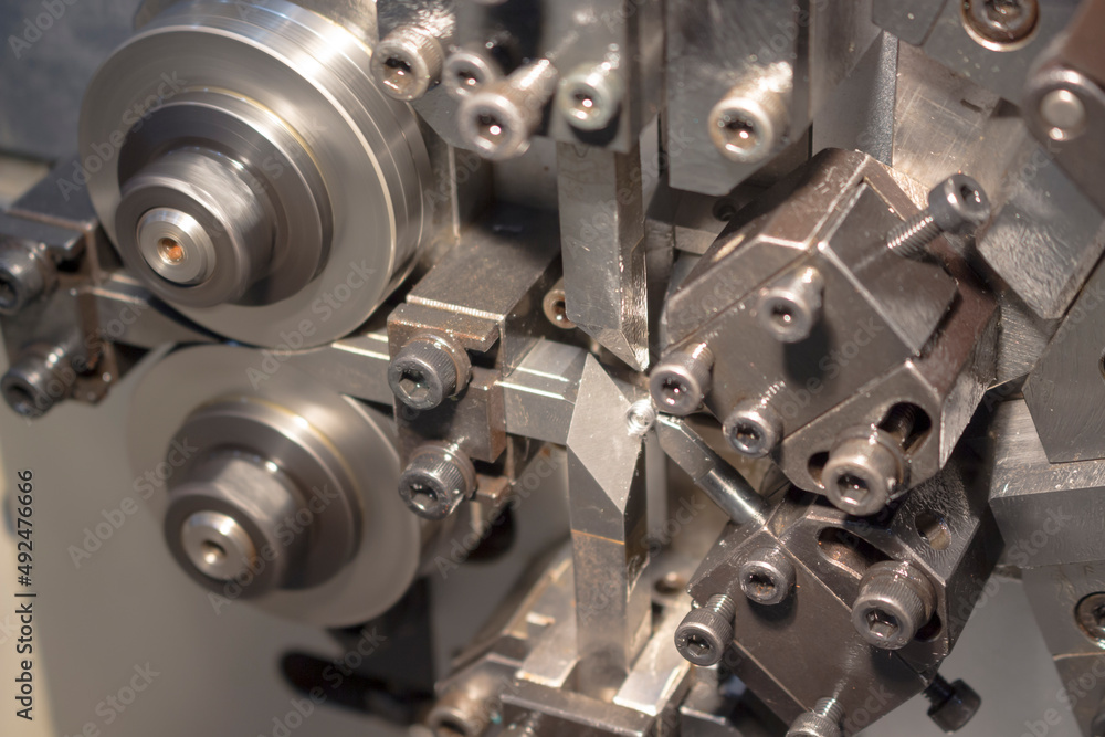 Blurred picture of small spring making machine Blurred picture of small spring making machine