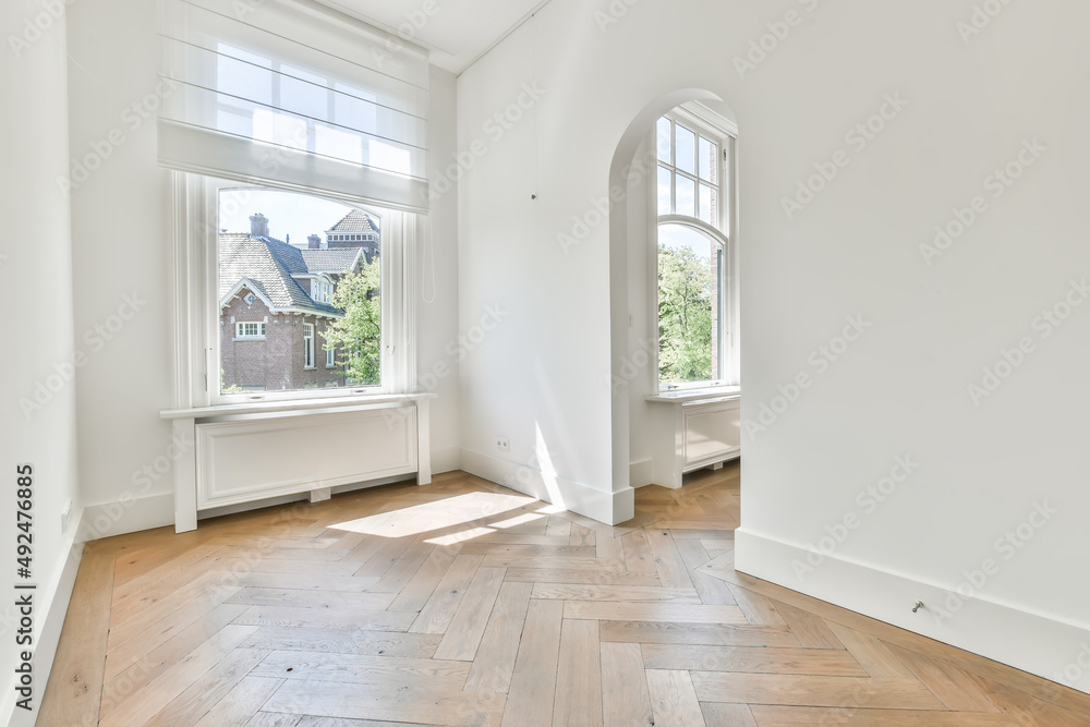 Calm yet luxurious hallway in a modern style with a window but no doors ...
