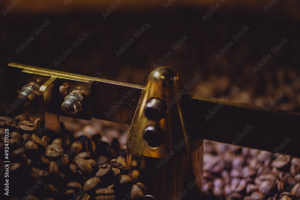 Golden coffee roaster machine in a mediumsized industrial roaster