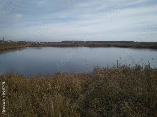 lake reservoir in autumn in cloudy weather cold climate in Siberia
