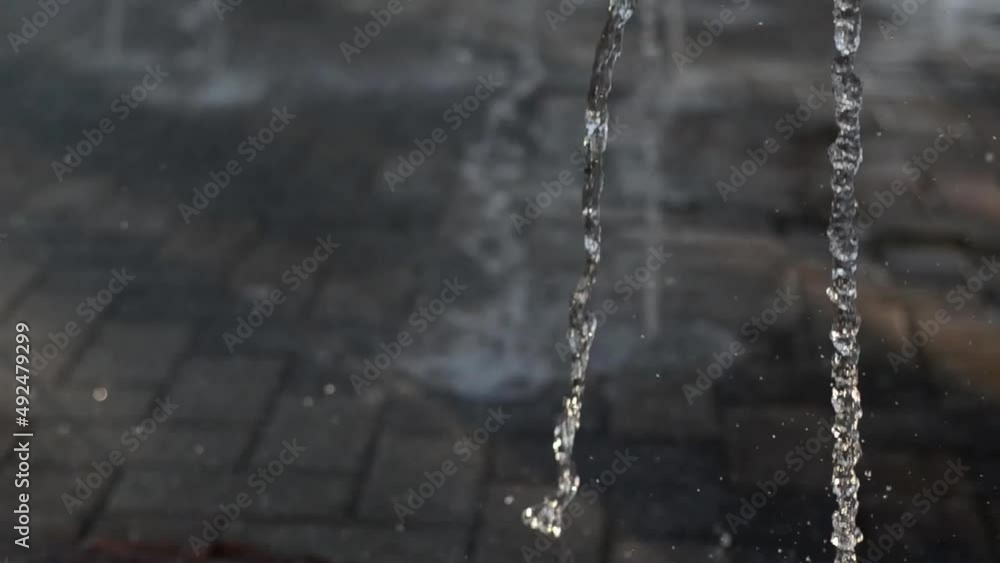 water flowing from a fountain in the park water flowing from a fountain in the park