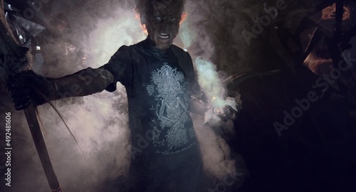 scary sorcerer in smoke. voodoo rite