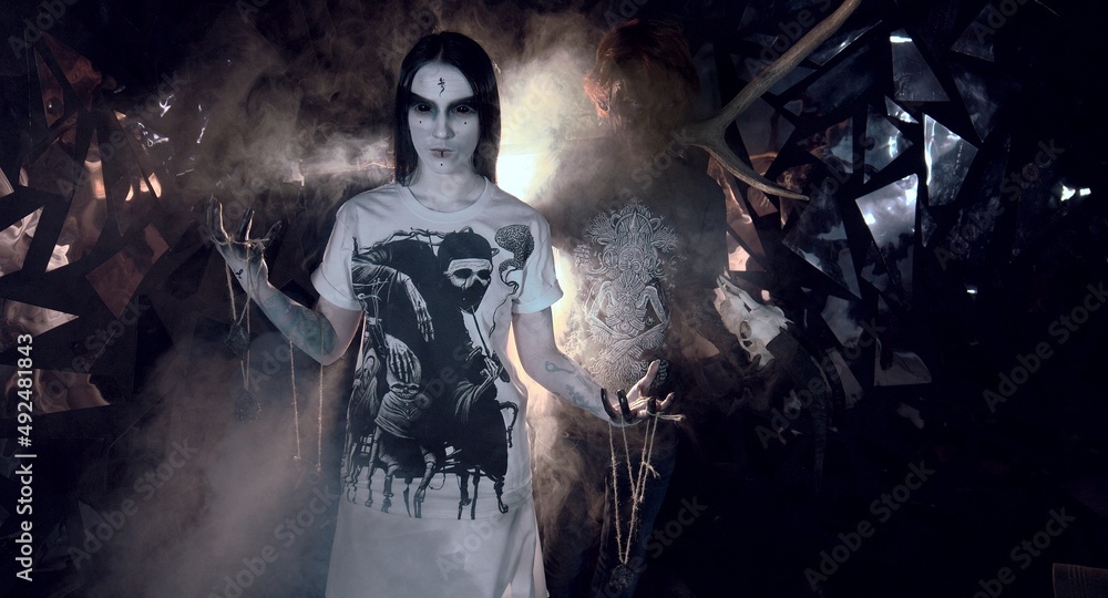 Fototapeta premium sorcerers stands in smoke. voodoo rite