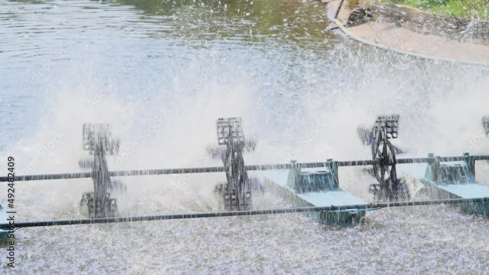 The water turbine is working to add oxygen for the pond water treatment process. Protect the environment. The water turbine is working to add oxygen for the pond water treatment process. Protect the environment.