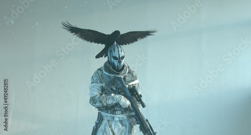 Fotografiet fighter with a crossbow and a raven, Apocalypse,