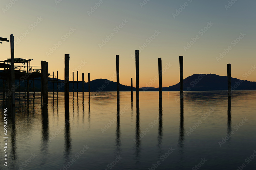 Long exposure at clear lake at sunrise showing old boat docks Long exposure at clear lake at sunrise showing old boat docks