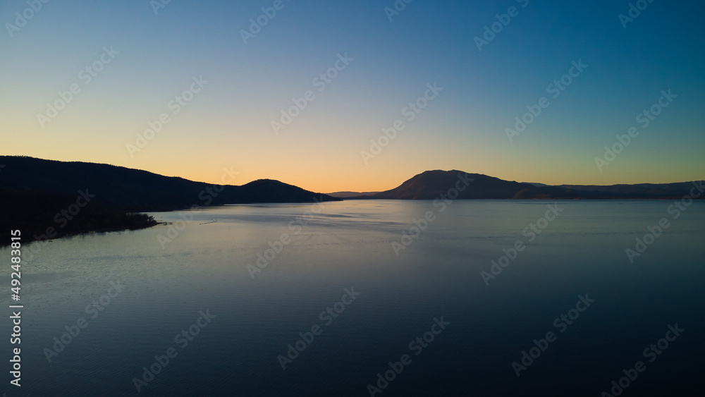Sunrise on clear lake near the down of Nice California