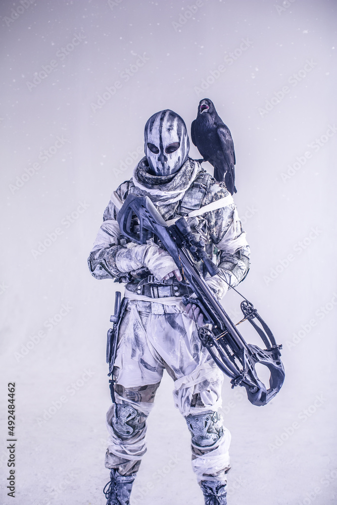 Naklejka premium fighter with a crossbow and a raven