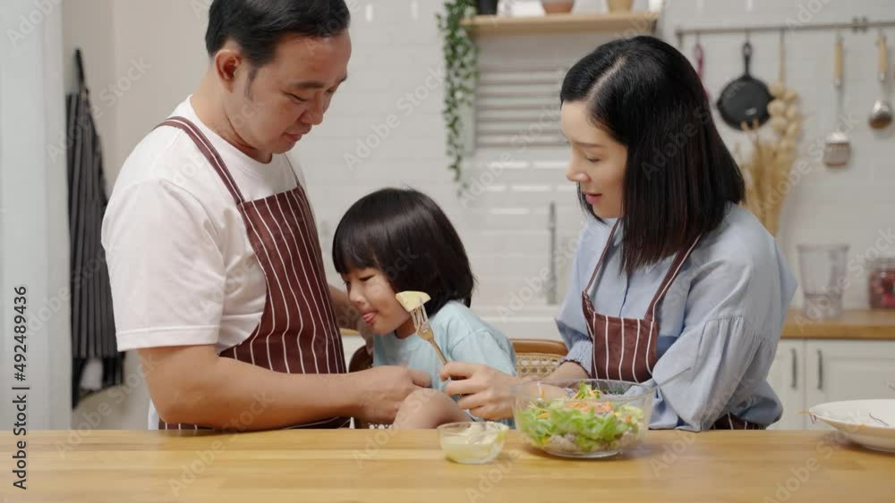 Asian boy who dislikes vegetables, is being asked by his parents to eat vegetables for his health.
Asian boy who dislikes vegetables, is being asked by his parents to eat vegetables for his health.