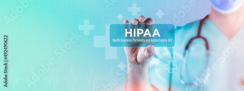 HIPAA (Health Insurance Portability and Accountability Act). Doctor holds virtual card in his hand. Medicine digital