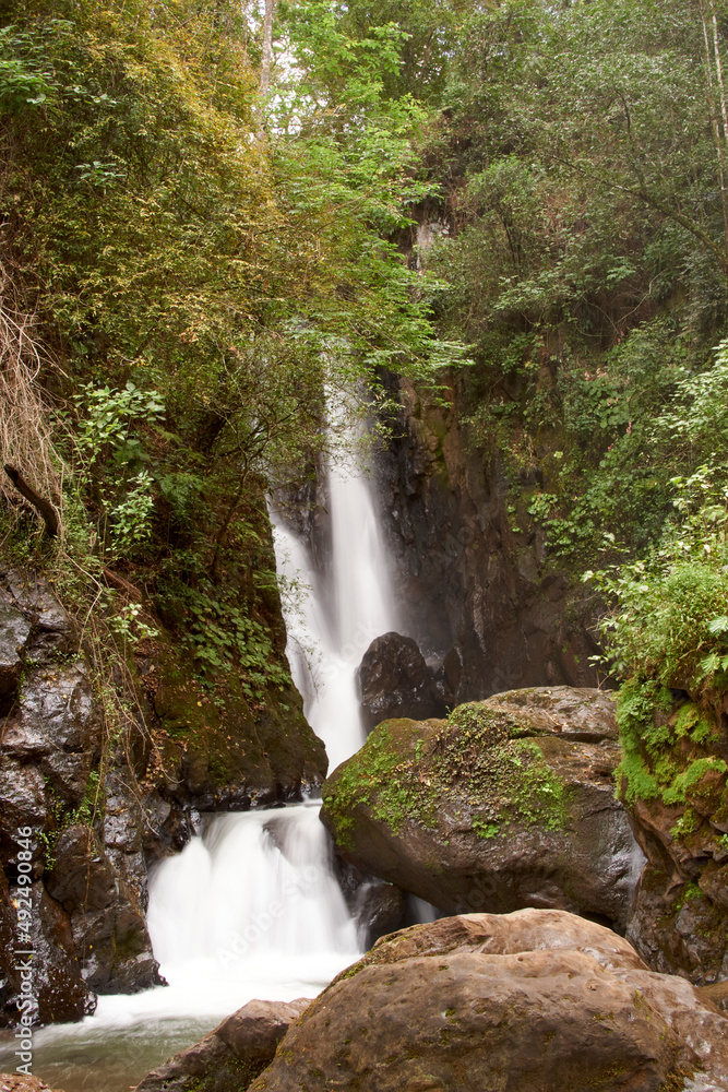 Beautiful waterfall with rocks and moss