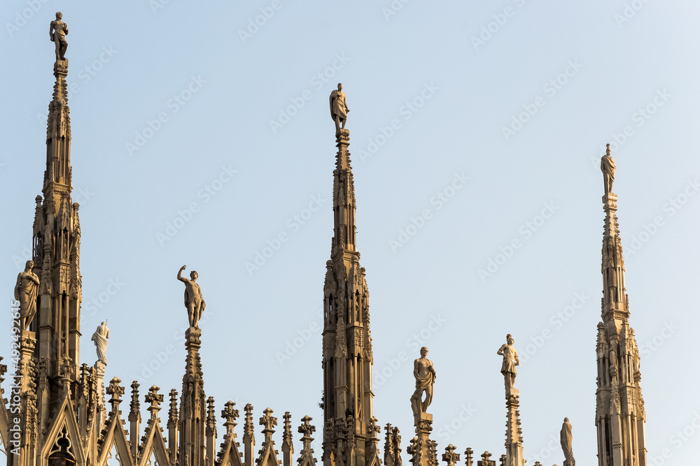 Architectural detail of The Milan Cathedral (Italian, Duomo di Milano), the cathedral church of Milan in Lombardy, Italy. Dedicated to the Nativity of St Mary it is the seat of the Archbishop of Milan Architectural detail of The Milan Cathedral (Italian, Duomo di Milano), the cathedral church of Milan in Lombardy, Italy. Dedicated to the Nativity of St Mary it is the seat of the Archbishop of Milan