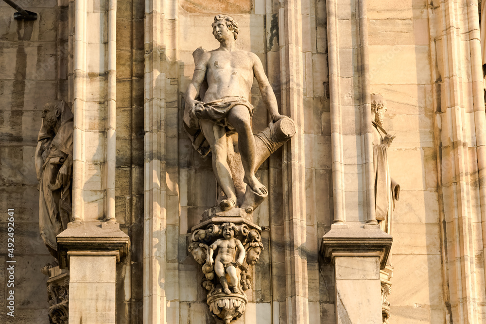 Obraz premium Architectural detail of The Milan Cathedral (Italian, Duomo di Milano), the cathedral church of Milan in Lombardy, Italy. Dedicated to the Nativity of St Mary it is the seat of the Archbishop of Milan