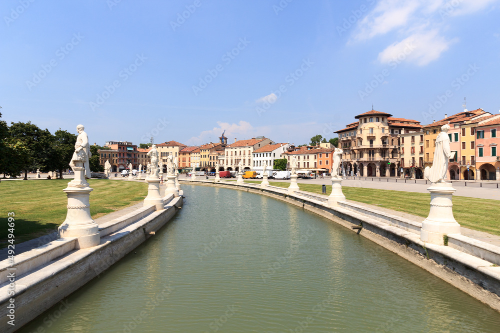Large square Prato della Valle with canal and statues in Padua, Italy