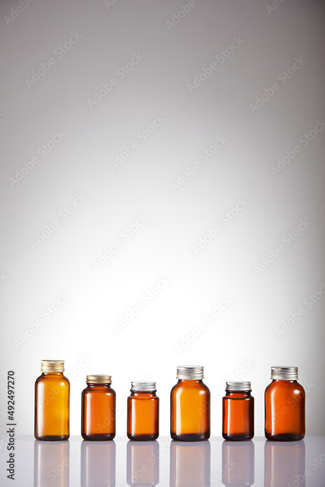 Set of empty brown glass medicine bottles. Amber bottle samples. Set of empty brown glass medicine bottles. Amber bottle samples.