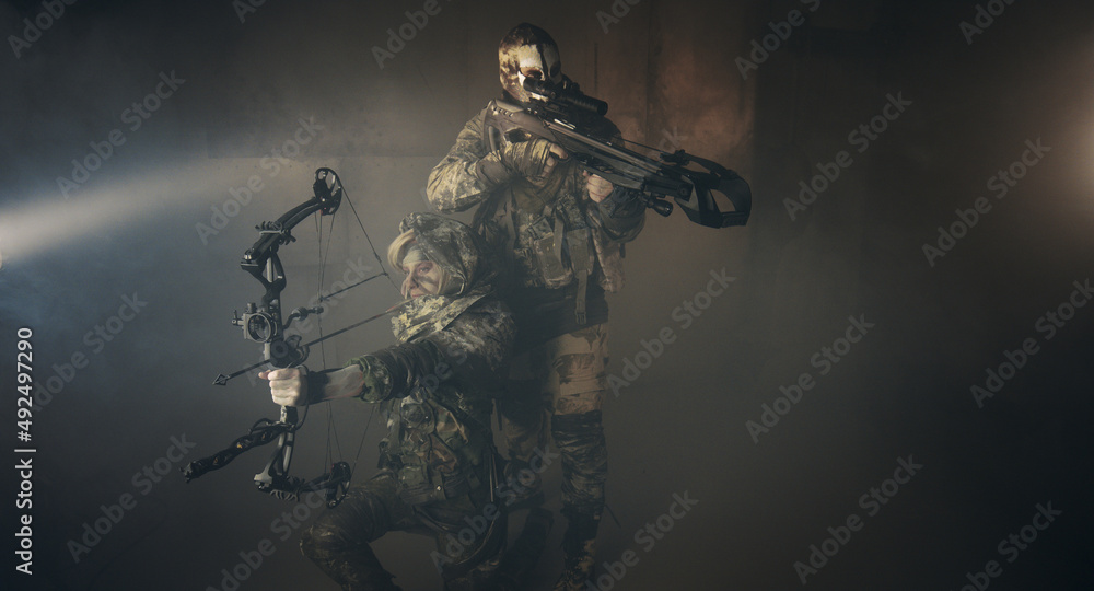 apocalypse fighters. a girl with a bow and a guy with a crossbow. apocalypse fighters. a girl with a bow and a guy with a crossbow.