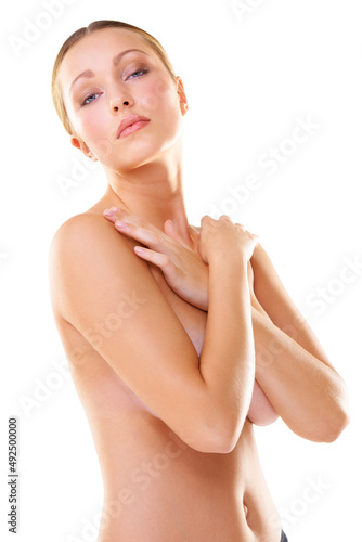 Confident in her beauty. Cropped shot of a half-nude young woman isolated on white.