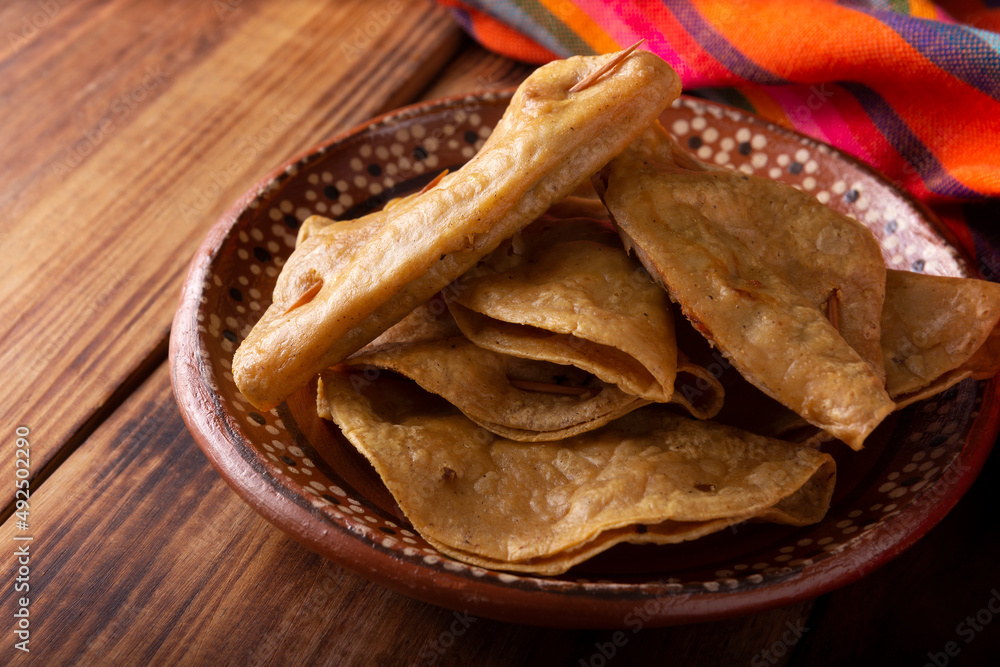 Quesadillas Doradas. Fried quesadillas made with corn tortillas, they can be filled with any dish or ingredient, such as meat, potato or fish such as marlin or tuna, popular during the Lenten season. Quesadillas Doradas. Fried quesadillas made with corn tortillas, they can be filled with any dish or ingredient, such as meat, potato or fish such as marlin or tuna, popular during the Lenten season.