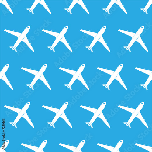 Vector illustration of an airplane top view on a blue background. Aviation holiday poster. Vector seamless pattern