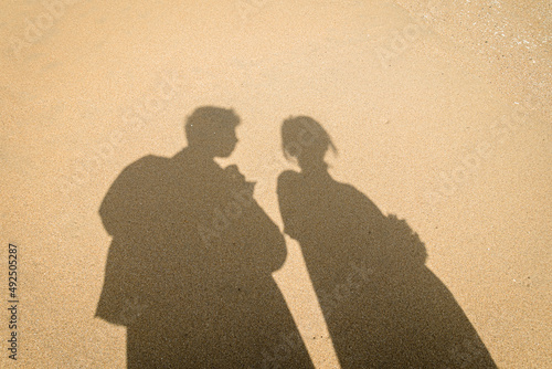 Shadow of a couple on the beach