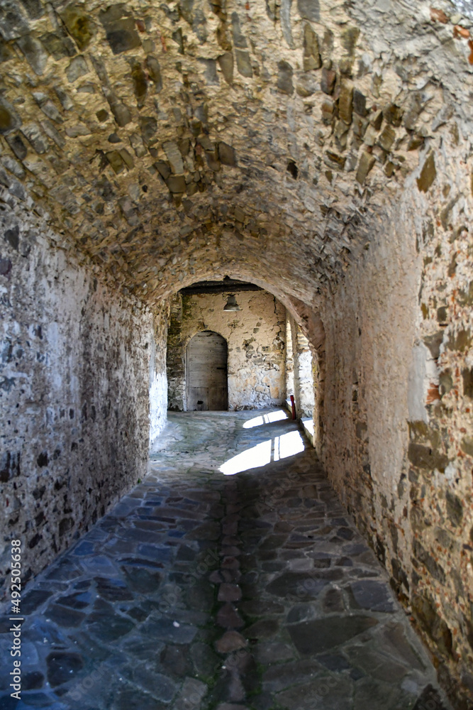 A narrow street among the old stone houses of Rocca Cilento, town in Salerno province, Italy.