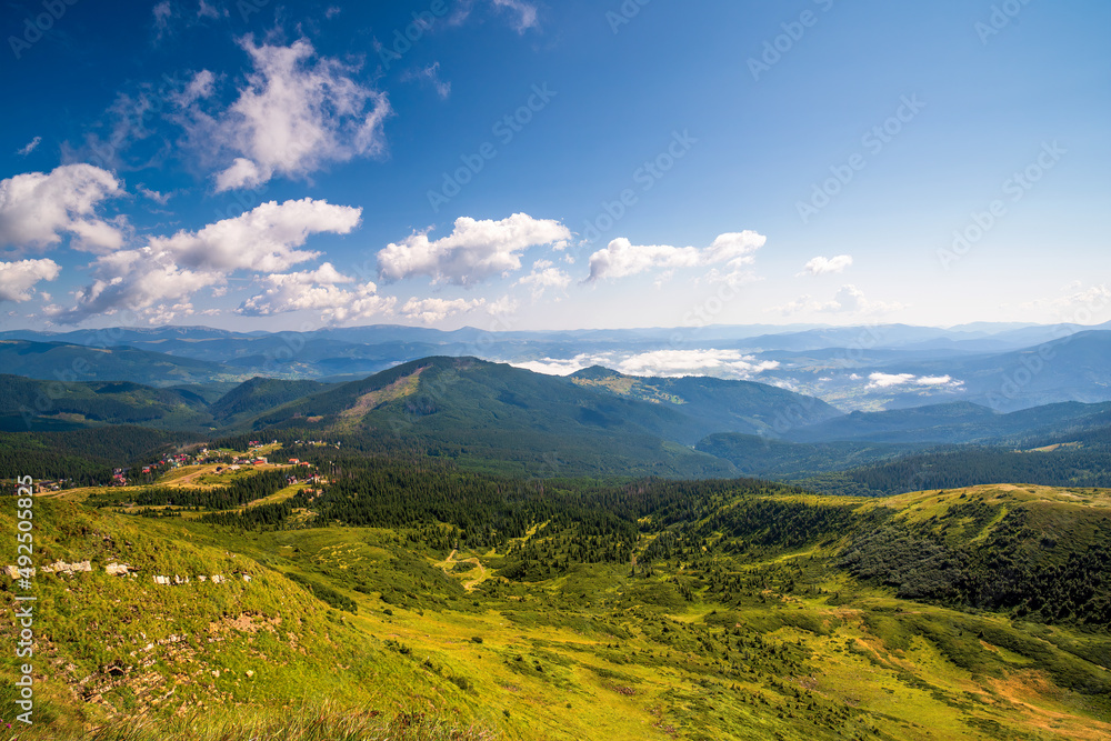Top view over mountain valley at summer day. Popular Drahobrat ski and hiking resort in Carpathian Mountains, Ukraine