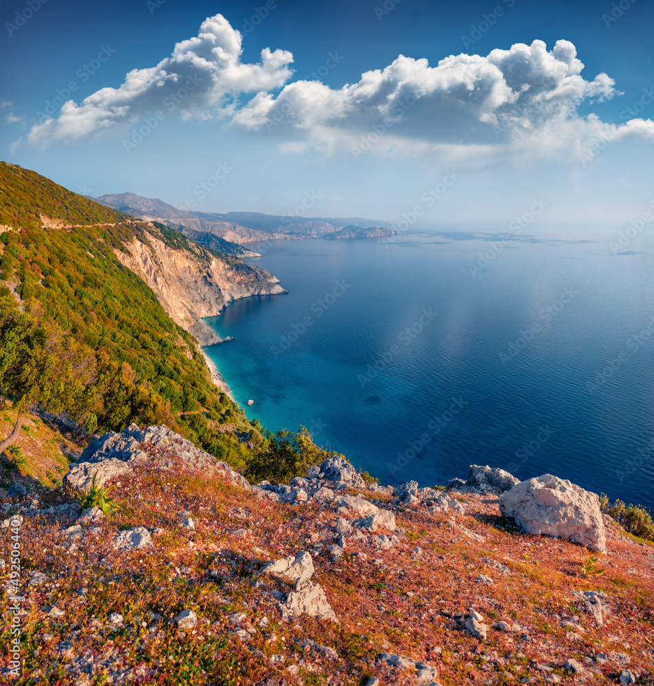 Aerial summer view of coast of Kefalonia island. Sunny morning seascape of Mediterranean Sea. Amazing outdoor scene of Greece, Europe. Beauty of nature concept background..