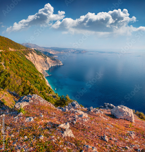 Aerial summer view of coast of Kefalonia island. Sunny morning seascape of Mediterranean Sea. Amazing outdoor scene of Greece, Europe. Beauty of nature concept background..