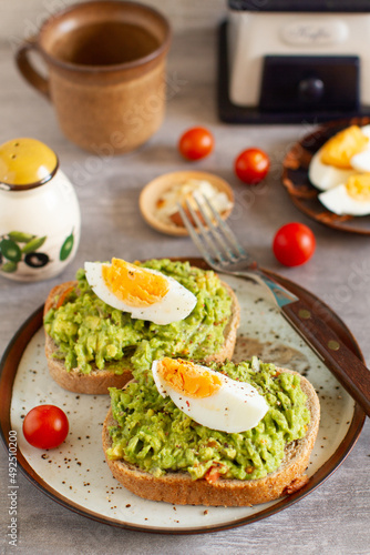 Healthy homemade rustic breakfast - Toast with avocado and egg