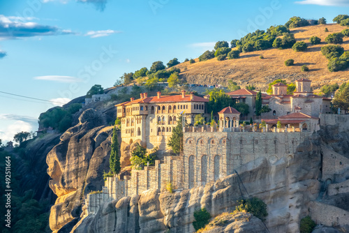 Greek Rock Monastery on the Background of a Hill photo