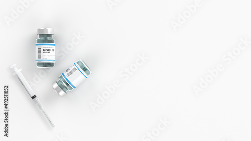 Overhead view of Ampoules with COVID-19 coronavirus vaccine and syringe. With copy space - 3d render