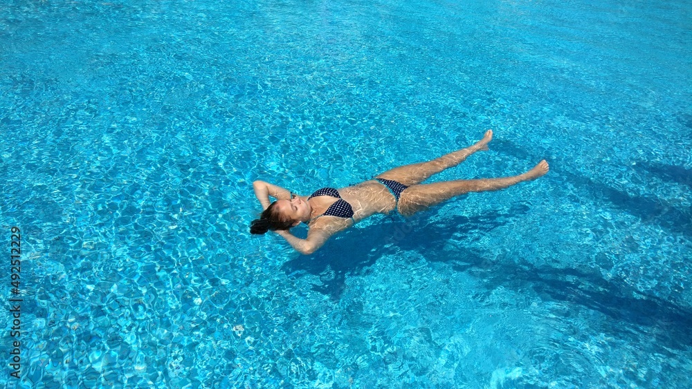 woman relaxing in the pool