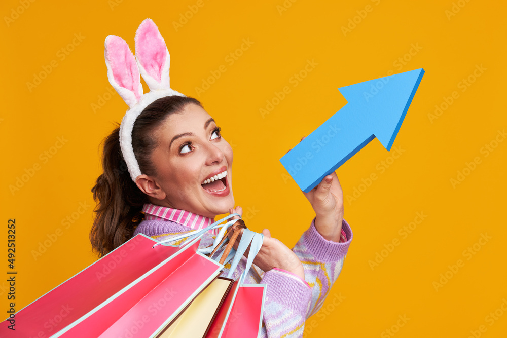 Studio shots of woman over yellow background easter style Studio shots of woman over yellow background easter style