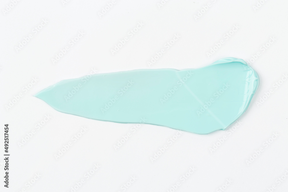 on a white background smeared with colored cream on a white background smeared with colored cream