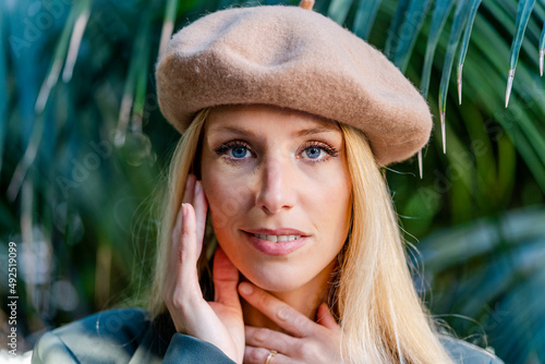 Beautiful blond woman wearing beret photo
