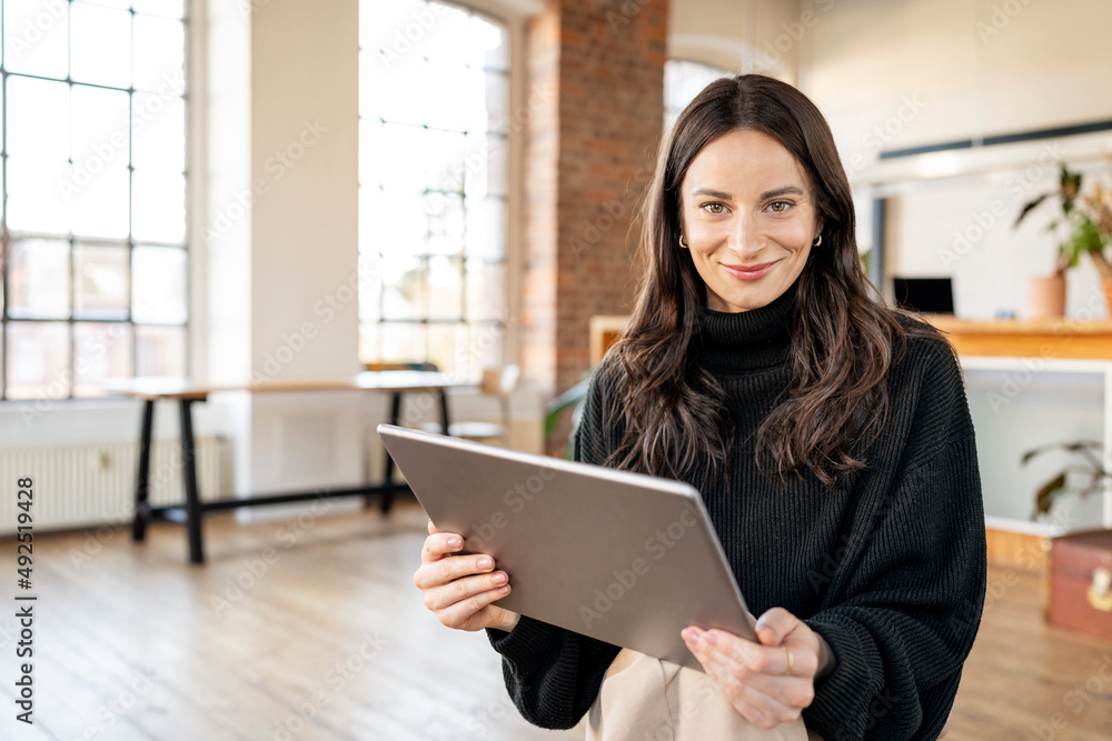 Beautiful freelancer with tablet PC sitting at home Beautiful freelancer with tablet PC sitting at home