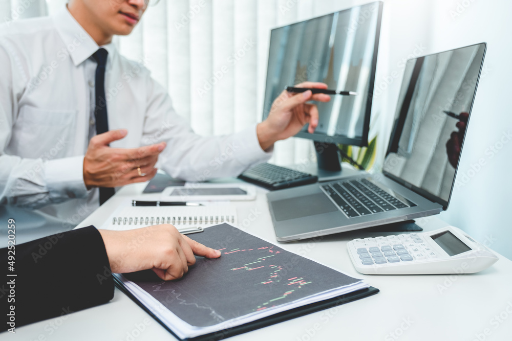 Business team Investment Entrepreneur Trading discussing and analysis graph stock market trading,stock chart concept Business team Investment Entrepreneur Trading discussing and analysis graph stock market trading,stock chart concept
