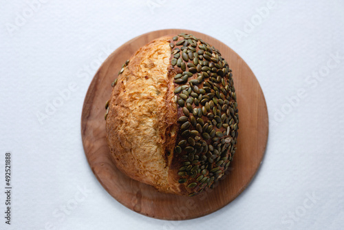 Rye bread on a board on a white tablecloth background