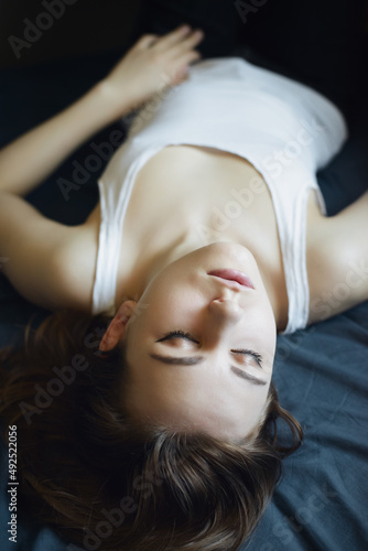 Portrait of a beautiful young woman with closed eyes.