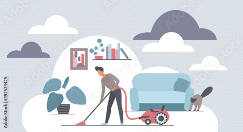Man cleaning home living room with vacuum cleaner. Housekeeper or worker of cleaning service doing cleanup, daily household hygiene, housekeeping with equipment for housework flat vector illustration