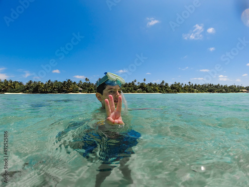 Little kid snorkeling in a Maldive Islands © Victor