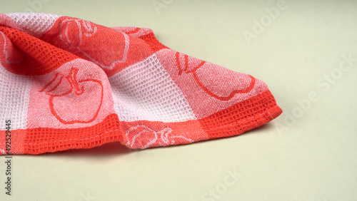 Folded kitchen textile towels of different colors, Household cleaning cloth. Closeup of cleaning rag isolated on a white background. 