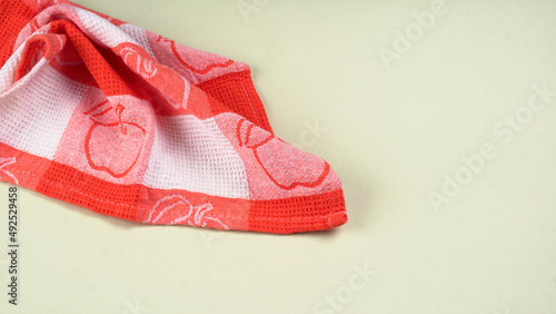 Folded kitchen textile towels of different colors, Household cleaning cloth. Closeup of cleaning rag isolated on a white background. 