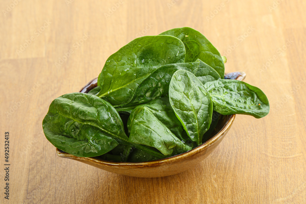 Fresh green spinach leaves in the bowl Fresh green spinach leaves in the bowl