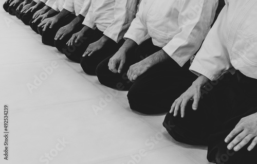 Photos People practicing aikido martial art in a dojo background