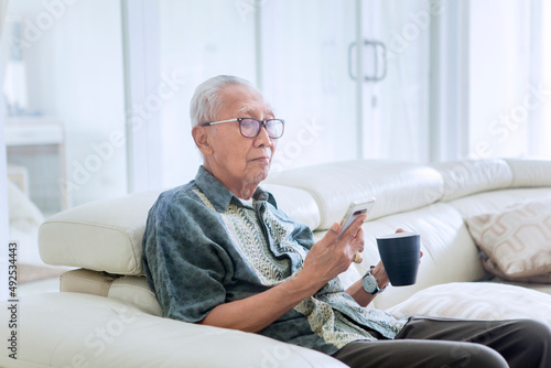 Elderly man enjoying leisure time at home