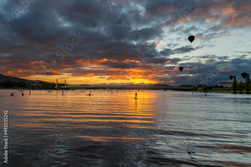 The image sums up the essence of the Balloon Spectacular, the balloons rising and drifting across the lake, energised by the rising sun, and watched by eager spectators on land and the water. 