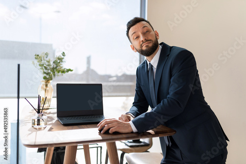 Quadro su tela respectable individual entrepreneur in a modern office at work on a laptop
